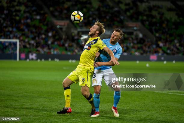 Andrew Hoole of the Central Coast Mariners heads the ball in front of Scott Jamieson of Melbourne City during Round 26 of the Hyundai A-League Series...