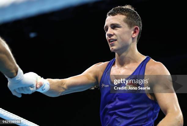 Peter McGrail of England celebrates winning the round of 16 bout against Benson Njangiru of Kenya on day three of the Gold Coast 2018 Commonwealth...