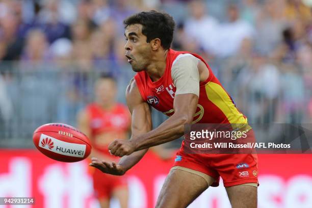 Jack Martin of the Suns handpasses the ball during the round three AFL match between the Gold Coast Suns and the Fremantle Dockers at Optus Stadium...