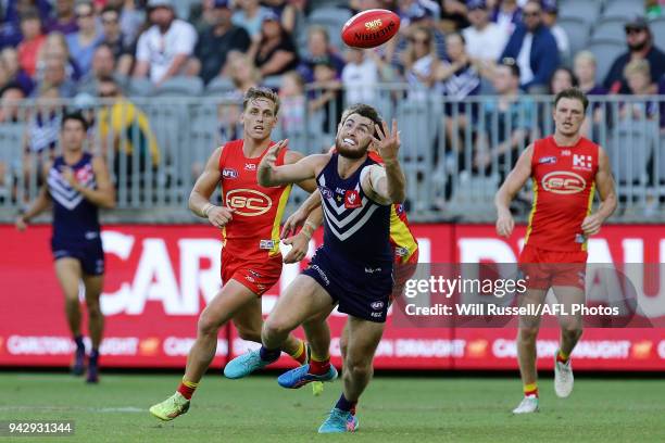 Connor Blakely of the Dockers marks the ball during the round three AFL match between the Gold Coast Suns and the Fremantle Dockers at Optus Stadium...