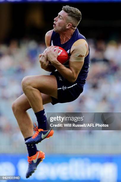 Luke Ryan of the Dockers takes a mark during the round three AFL match between the Gold Coast Suns and the Fremantle Dockers at Optus Stadium on...