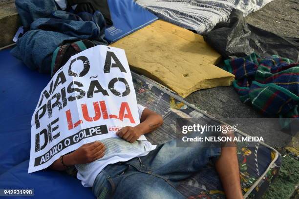 Supporters of former Brazilian president Luiz Inacio Lula da Silva sleep outside the metalworkers' union building in Sao Bernardo do Campo, in...