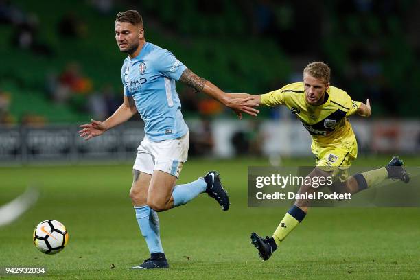 Bart Schenkeveld of Melbourne City and Trent Buhagiar of Central Coast Mariners contest the ball during the round 26 A-League match between Melbourne...