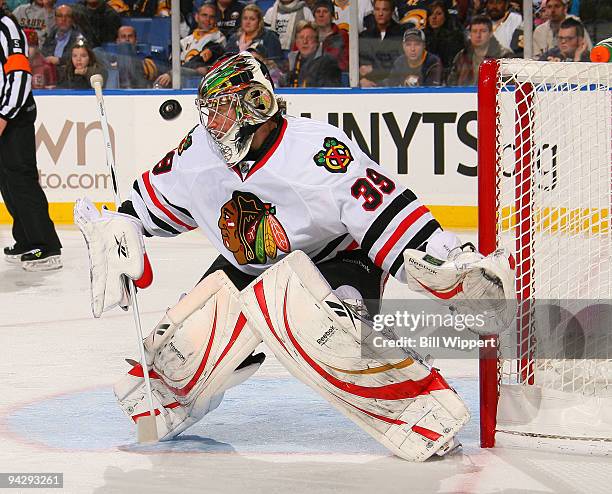 Cristobal Huet of the Chicago Blackhawks follows the flying puck in their 2-1 loss to the Buffalo Sabres on December 11, 2009 at HSBC Arena in...