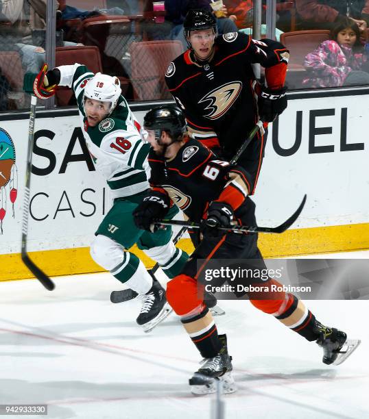 Jason Zucker of the Minnesota Wild battles for position against Marcus Pettersson and Andy Welinski of the Anaheim Ducks during the game on April 4,...