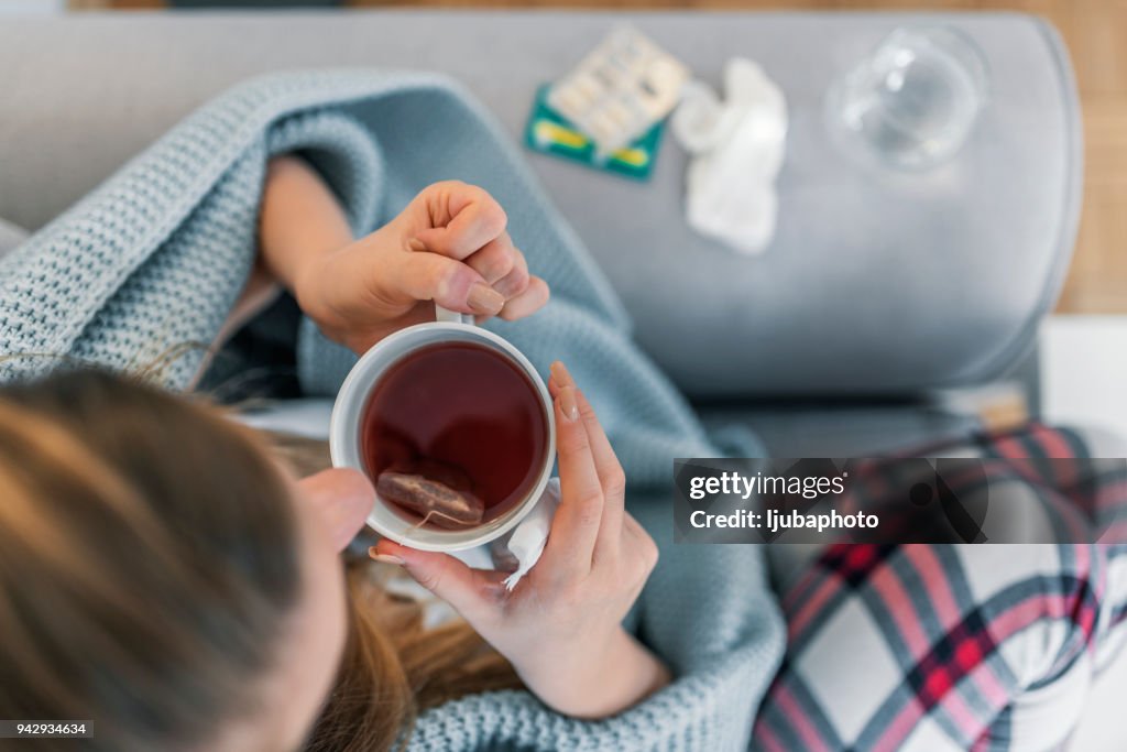 Woman suffering from cold flu