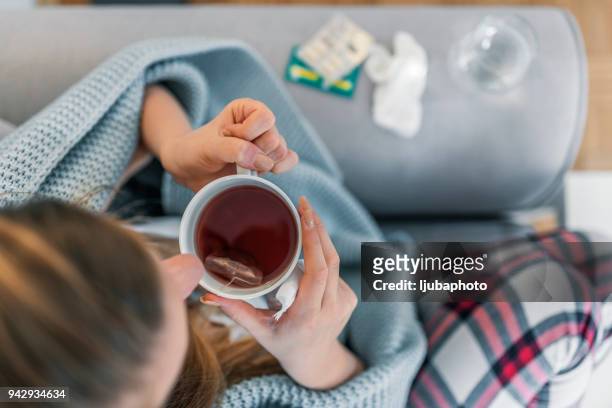 woman suffering from cold flu - drinking cold drink stock pictures, royalty-free photos & images