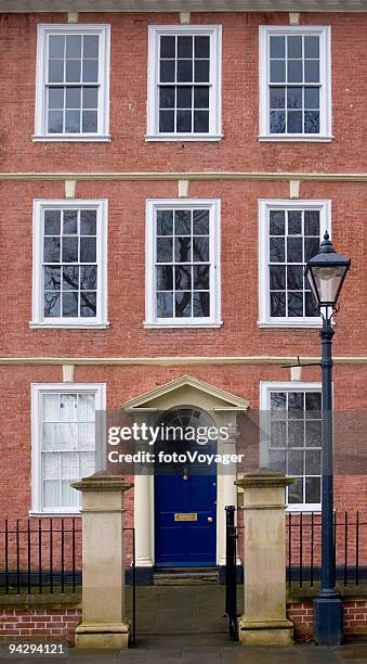 brick townhouse - money piling up stock pictures, royalty-free photos & images