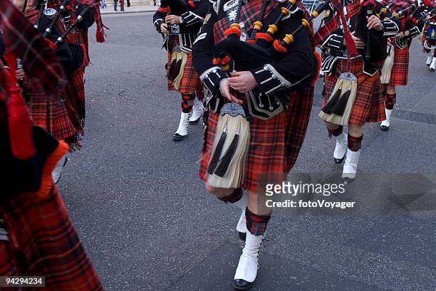 bagpipes and kilts - edinburgh scotland stock pictures, royalty-free photos & images
