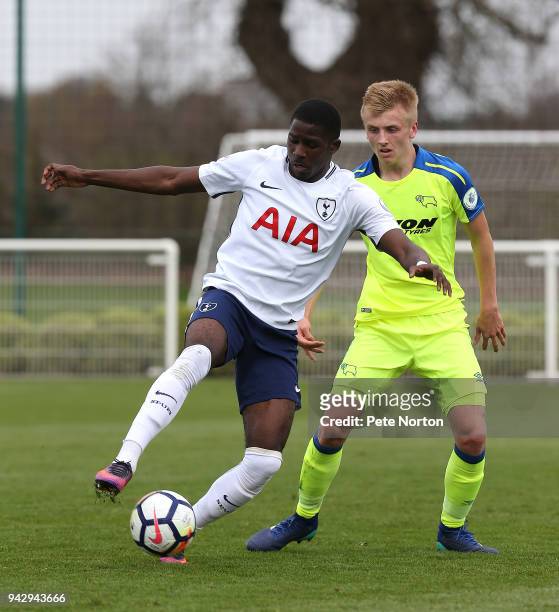 Shilow Tracey of Tottenham Hotspur controls the ball under pressure from Louie Sibley of Derby County during the Premier League 2 match between...