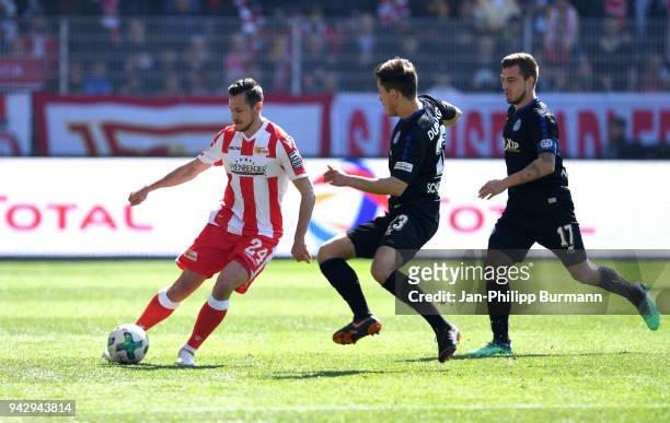 Steven Skrzybski of 1 FC Union Berlin, Fabian Schnellhardt and Kevin Wolze of MSV Duisburg during the 2nd Bundesliga game between Union Berlin and...