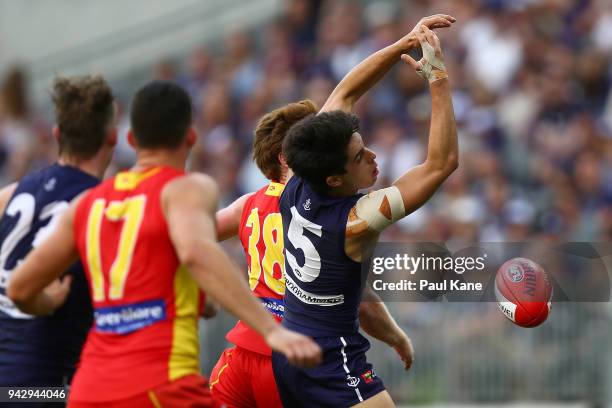 Adam Cerra of the Dockers misses a mark during the round three AFL match between the Gold Coast Suns and the Fremantle Dockers at Optus Stadium on...