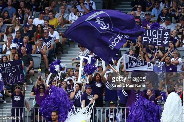 Dockers fans celebrate a goal during the round three AFL match between the Gold Coast Suns and the Fremantle Dockers at Optus Stadium on April 7,...