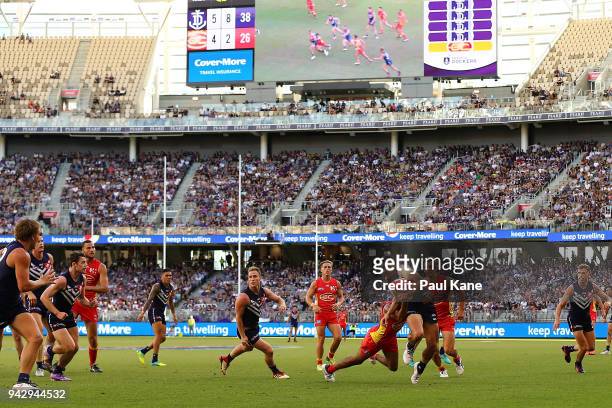 Stephen Hill of the Dockers looks to break from a tackle during the round three AFL match between the Gold Coast Suns and the Fremantle Dockers at...