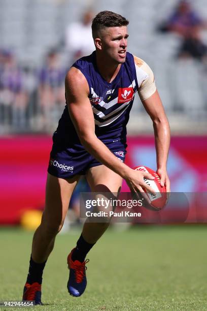 Luke Ryan of the Dockers looks to pass the ball during the round three AFL match between the Gold Coast Suns and the Fremantle Dockers at Optus...