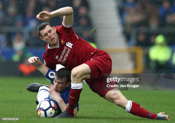 Seamus Coleman of Everton is challenged by James Milner of Liverpool during the Premier League match between Everton and Liverpool at Goodison Park...