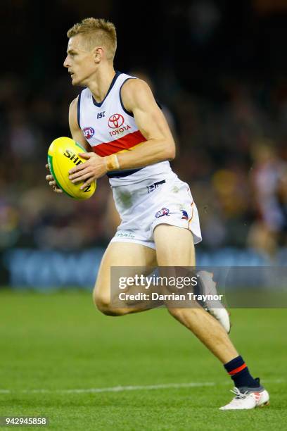 David Mackay of the Crows runs with the ball during the round three AFL match between the St Kilda Saints and the Adelaide Crows at Etihad Stadium on...