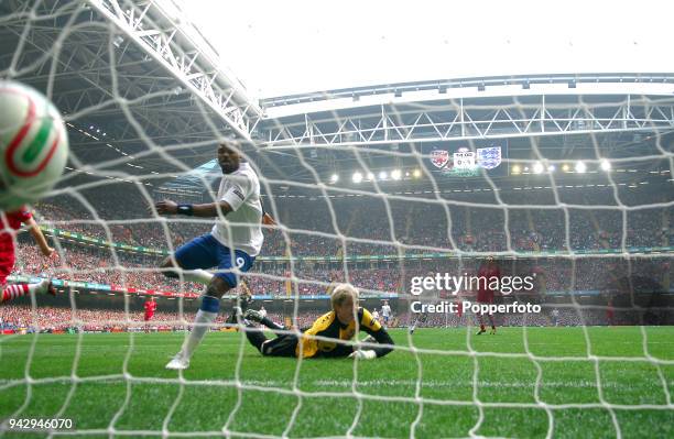 Darren Bent of England scores a goal during the UEFA EURO 2012 Group G qualifying match between Wales and England at the Millennium Stadium on March...