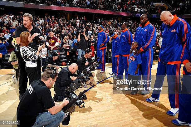 Shaquille O'Neal of the Cleveland Cavaliers stands with a child from the "Make-a-Wish" foundation during the National Anthem prior to the game...