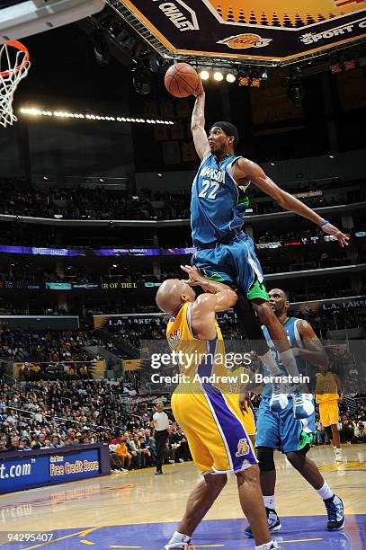 Corey Brewer of the Minnesota Timberwolves goes up for a dunk against Derek Fisher of the Los Angeles Lakers at Staples Center on December 11, 2009...