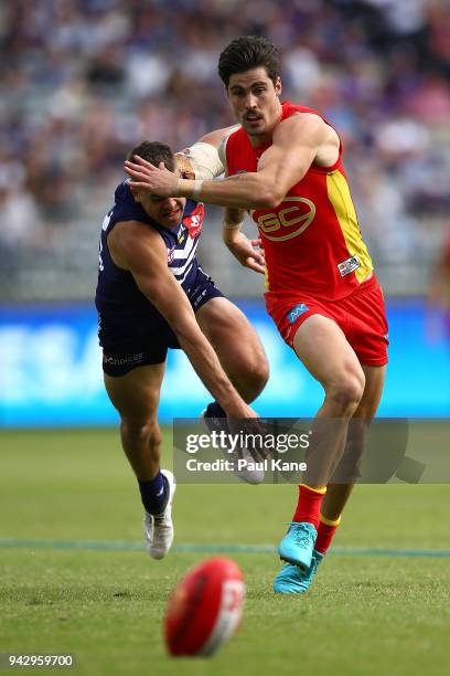 Stephen Hill of the Dockers and Alex Sexton of the Suns contest for the ball during the round three AFL match between the Gold Coast Suns and the...