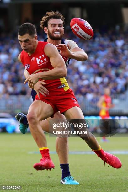 Connor Blakely of the Dockers spoils the mark for Ben Ainsworth of the Suns during the round three AFL match between the Gold Coast Suns and the...