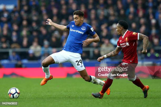 Dominic Calvert-Lewin of Everton and Nathaniel Clyne of Liverpool battle for possession during the Premier League match between Everton and Liverpool...