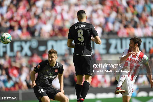 Jonas Hector of Koeln shoots on target and scores a goal to make it 1:0 during the Bundesliga match between 1. FC Koeln and 1. FSV Mainz 05 at...