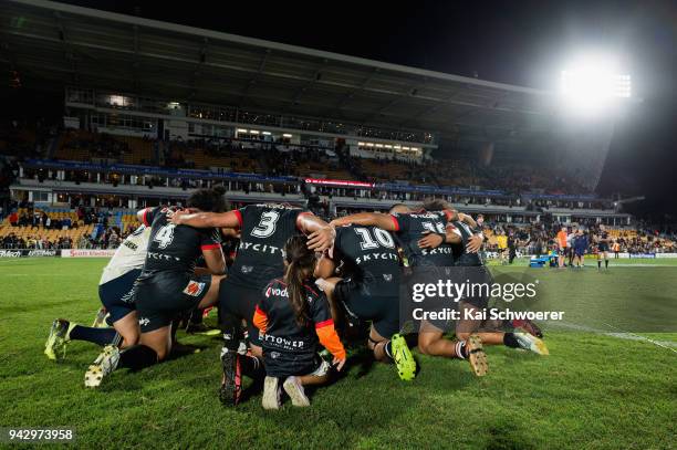 Players pray on the field following the round five NRL match between the New Zealand Warriors and the North Queensland Cowboys at Mt Smart Stadium on...