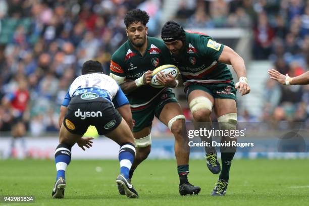 Valentino Mapapalangi of Leicester Tigers takes on Ben Tapuai of Bath Rugby, with support from Sione Kalamafoni of Leicester Tigers during the Aviva...