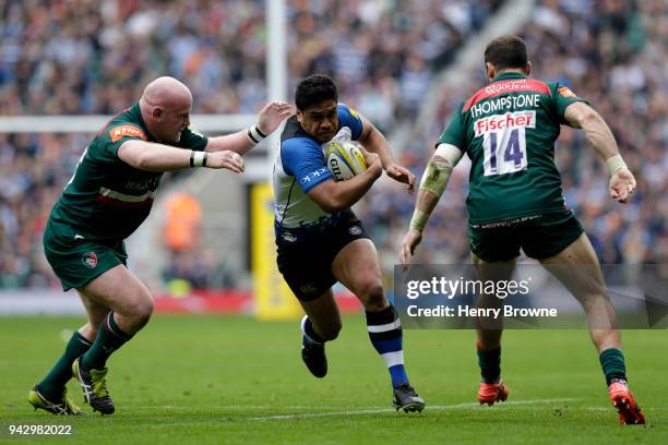 Ben Tapuai of Bath Rugby is tackled by Dan Cole of Leicester Tigers during the Aviva Premiership match between Bath Rugby and Leicester Tigers at...