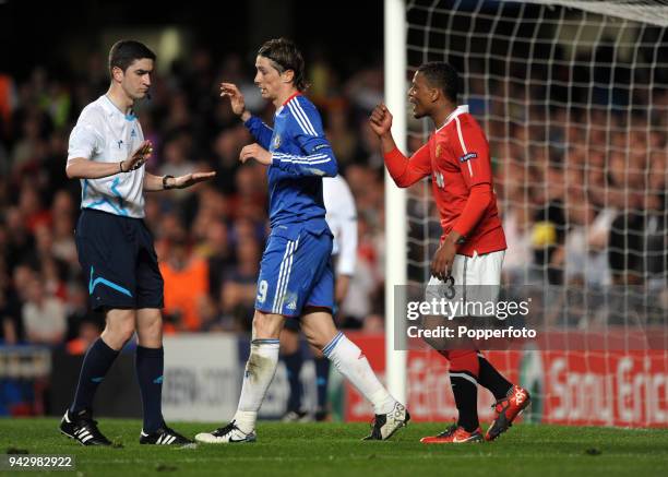 Patrice Evra of Manchester United and Fernando Torres of Chelsea appealing to referee Alberto Undiano Mallenco during the UEFA Champions League...