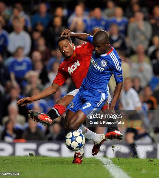 Ramires of Chelsea is tackled by Patrice Evra of Manchester United during the UEFA Champions League quarter final first leg match between Chelsea and...