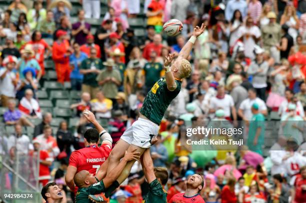 Ryan Oosthuizen of South Africa wins a line out during their match against Scotland on the second day of the Hong Kong Sevens on April 7, 2018 in...