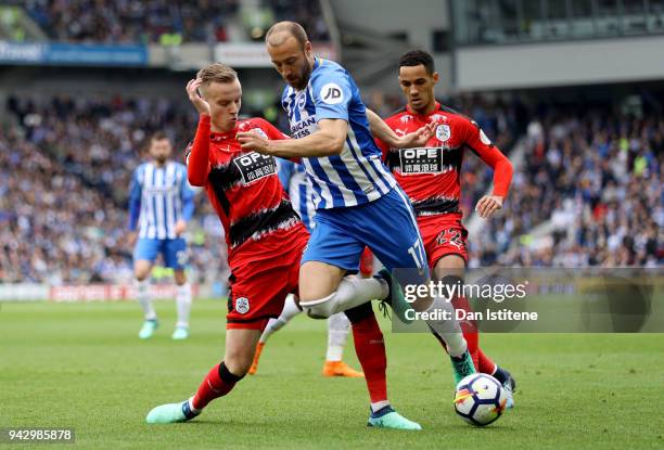 Glenn Murray of Brighton and Hove Albion and Florent Hadergjonaj of Huddersfield Town battle for the ball during the Premier League match between...