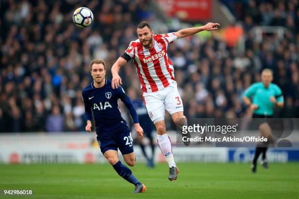 Christian Eriksen of Tottenham Hotspur in action with Erik Pieters of Stoke City during the Premier League match between Stoke City and Tottenham...