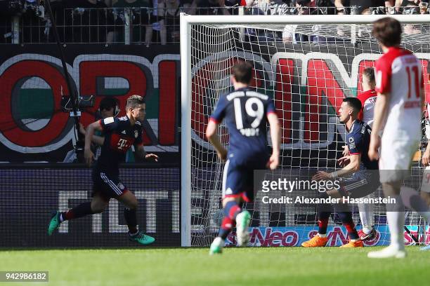 James Rodriguez of Bayern Muenchen celebrates after he scored a goal to m are it 1:2 during the Bundesliga match between FC Augsburg and FC Bayern...