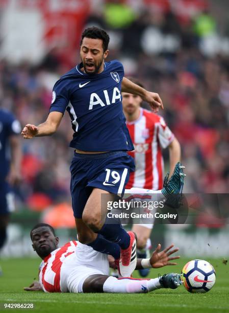 Mousa Dembele of Tottenham Hotspur is tackled by Badou Ndiaye of Stoke City during the Premier League match between Stoke City and Tottenham Hotspur...