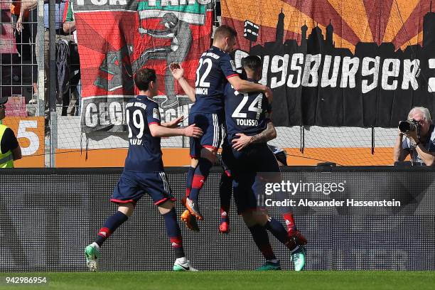 James Rodriguez of Bayern Muenchen celebrates with his team after he scored a goal to m are it 1:2 during the Bundesliga match between FC Augsburg...