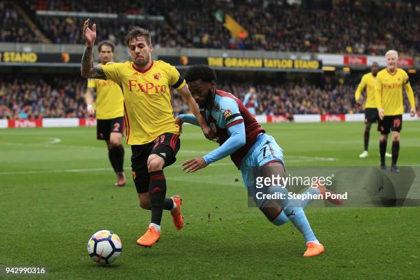Kiko Femenia of Watford battles for possesion with Georges-Kevin Nkoudou of Burnley during the Premier League match between Watford and Burnley at...
