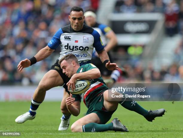 George Ford of Leicester holds onto the ball as Kahn Fotuali'i challenges during the Aviva Premiership match between Bath Rugby and Leicester Tigers...