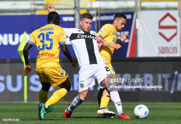 Riccardo Gagliolo of Parma Calcio competes for the ball whit Yussif Raman Chibsah and Camillo Ciano of Frosinone during the serie B match between...