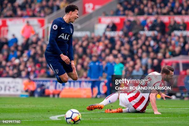 Stoke City's Dutch defender Erik Pieters fouls Tottenham Hotspur's English midfielder Dele Alli during the English Premier League football match...