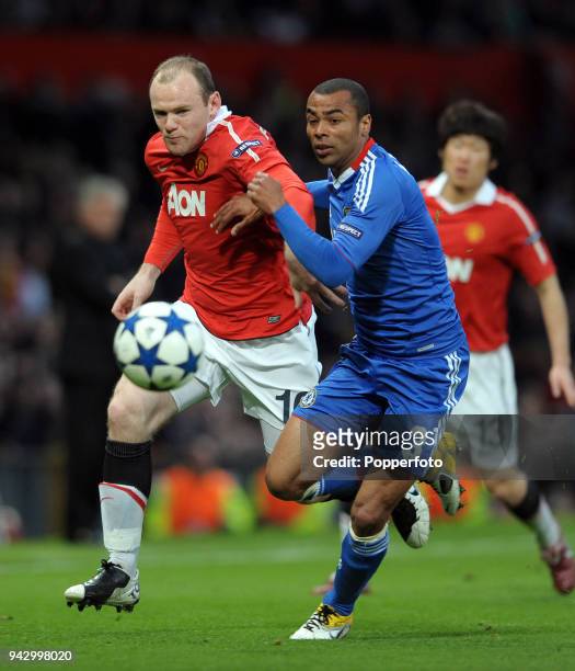 Wayne Rooney of Manchester United and Ashley Cole of Chelsea in action during the UEFA Champions League Quarter-Final second leg match between...