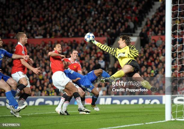 Manchester United goalkeeper Edwin van der Sar saves a shot by Florent Malouda during the UEFA Champions League Quarter-Final second leg match...