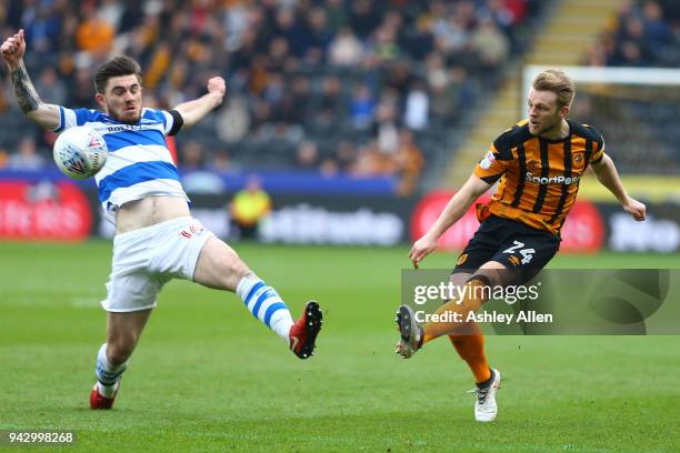 Max Clark of Hull City crosses the ball as Ryan Manning of Queens Park Rangers attempts to block during the Sky Bet Championship match between Hull...