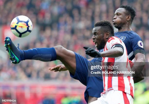 Stoke City's Senegalese striker Mame Biram Diouf vies with Tottenham Hotspur's Kenyan midfielder Victor Wanyama during the English Premier League...