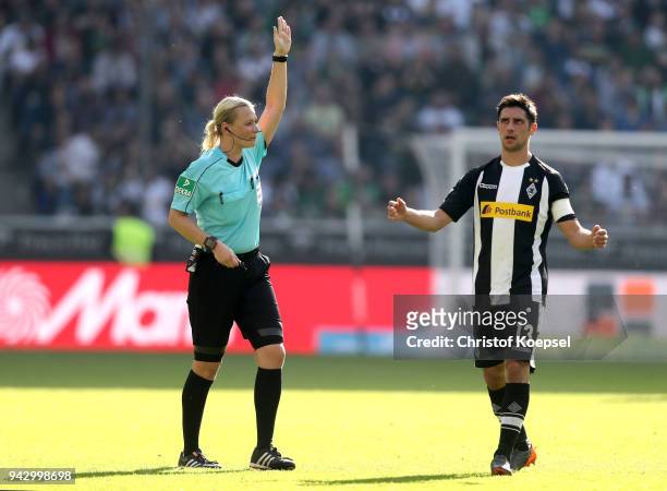Lars Stindl of Moenchengladbach reacts after referee Bibiana Steinhaus rejects the goal of Patrick Herrmann during the Bundesliga match between...
