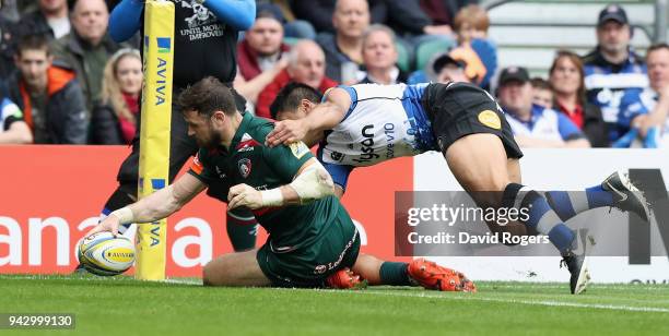 Adam Thompstone of Leicester dives over for their first try during the Aviva Premiership match between Bath Rugby and Leicester Tigers at Twickenham...