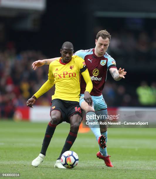 Watford's Abdoulaye Doucoure and Burnley's Ashley Barnes during the Premier League match between Watford and Burnley at Vicarage Road on April 7,...